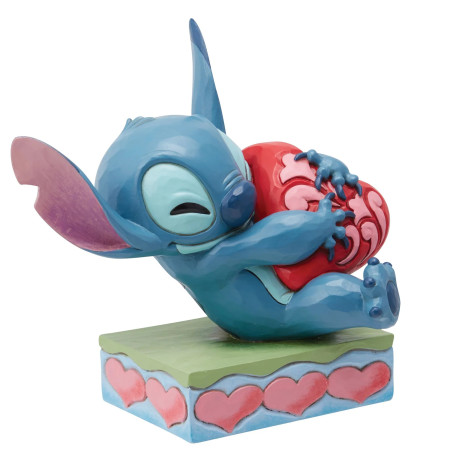 Enesco - Tradizione Disney di Jim Shore - Lilo e Stich - Stitch che coccola un cuore