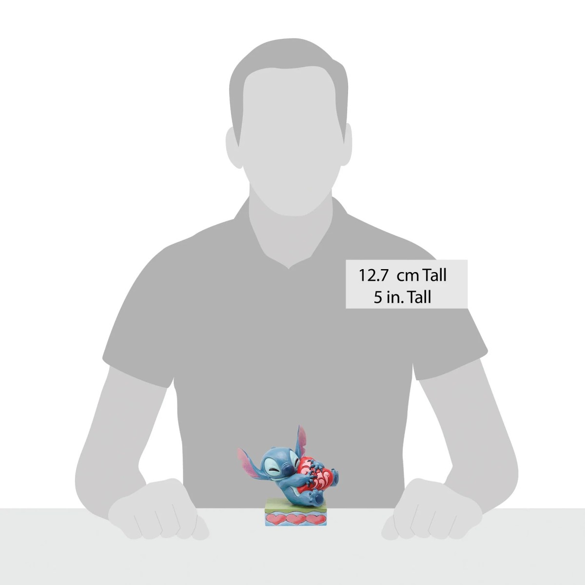 Enesco - Tradizione Disney di Jim Shore - Lilo e Stich - Stitch che coccola un cuore